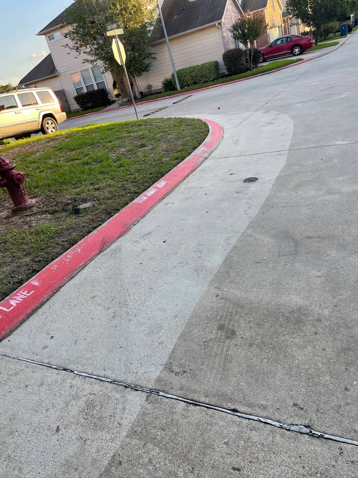 Pressure washing crew cleaning the HOA entrance walkway in Houston, TX