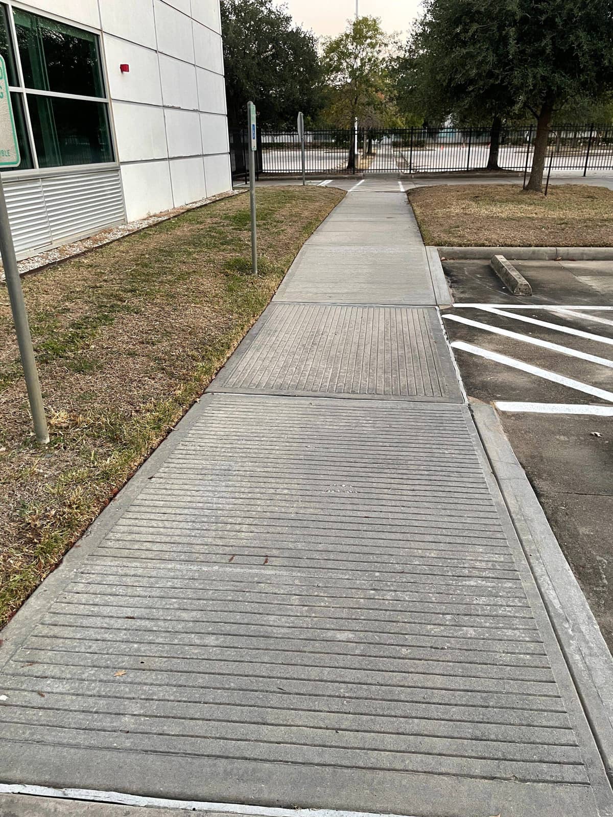 Clean concrete entryway after post-construction pressure washing in Tomball, TX