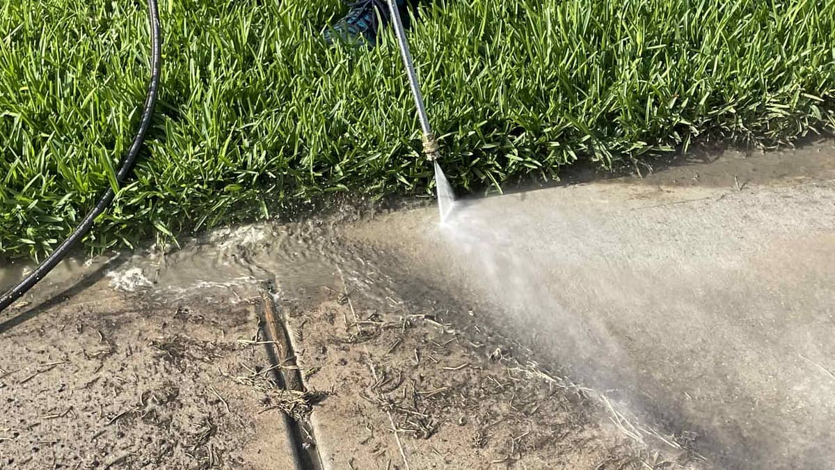 Freshly pressure washed sidewalk leading up to the front entry in Tomball, TX