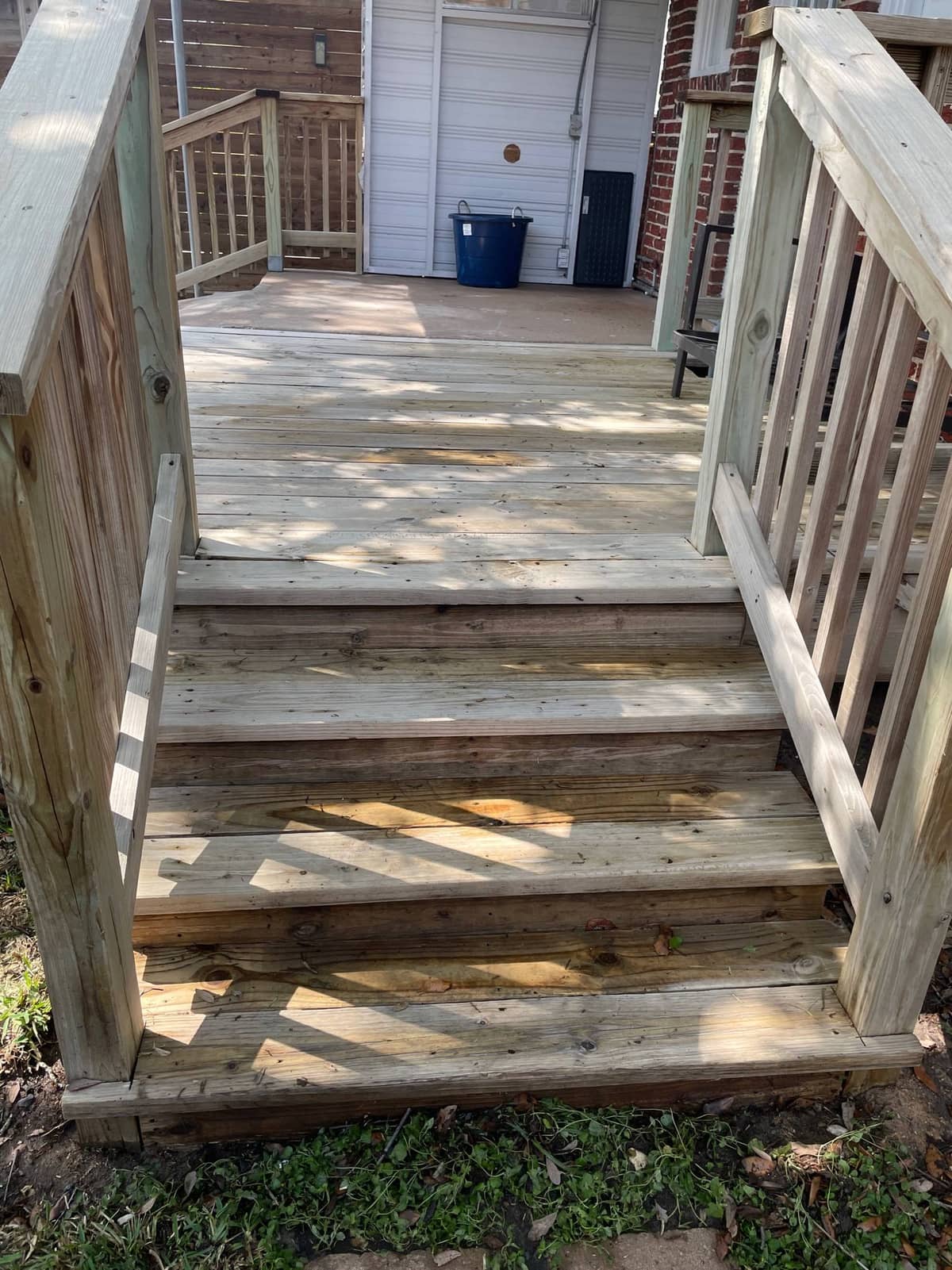 Freshly cleaned garage door and driveway before the home hit the market