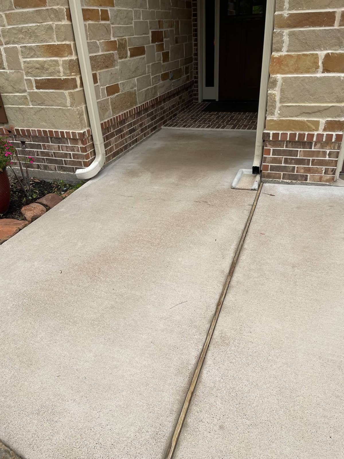 Completed driveway and exterior cleaning ahead of listing photos in Huntsville, TX